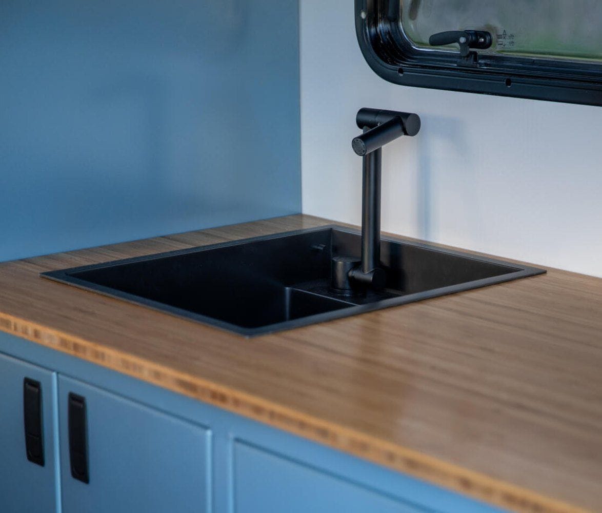 alaskan-hs-640-composite-pickup-camper-11-kitchen-sink-detail-1174x1000.jpg | Image